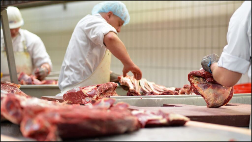 A butcher cutting meat