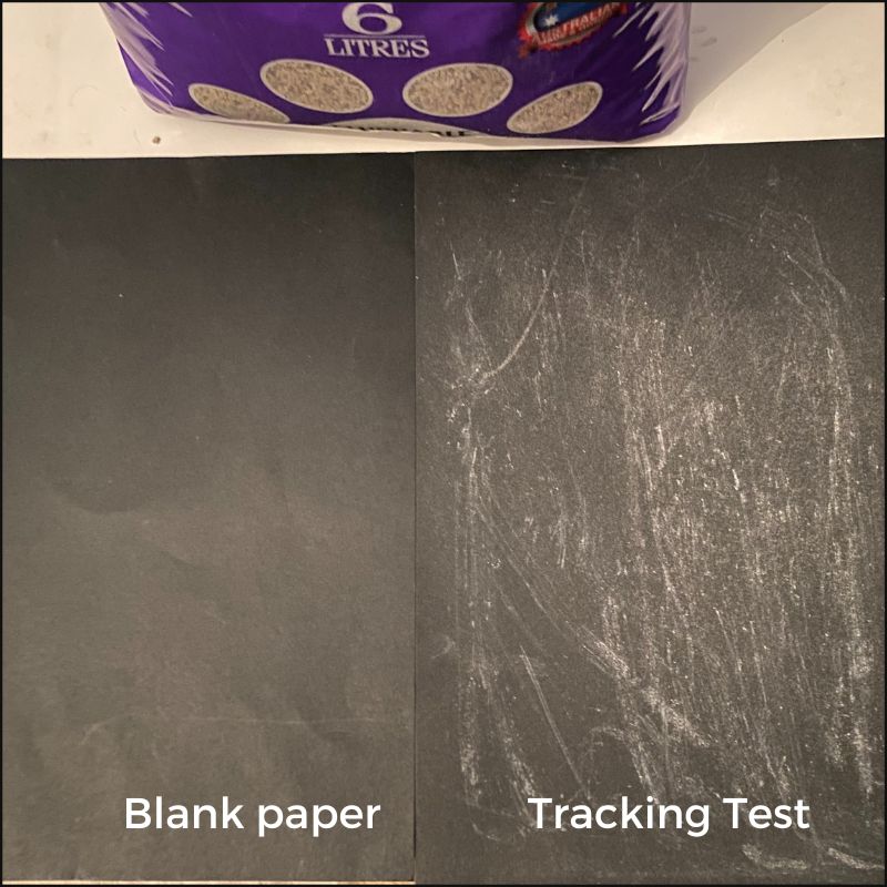 A photo showing how much residue and tracking is left in the cat litter tray after using Catlux softwood cat litter